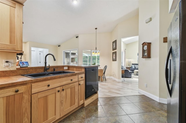 160 Sage Cir, Crystal Beach, FL 34681 - kitchen with black appliances, a sink, vaulted ceiling, a peninsula, and pendant lighting