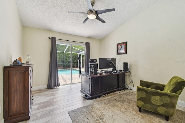 160 Sage Cir, Crystal Beach, FL 34681 - office space featuring a ceiling fan, a textured ceiling, wood finished floors, vaulted ceiling, and baseboards