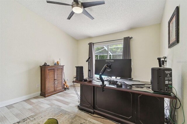 160 Sage Cir, Crystal Beach, FL 34681 - office area featuring a textured ceiling, ceiling fan, wood finished floors, and baseboards