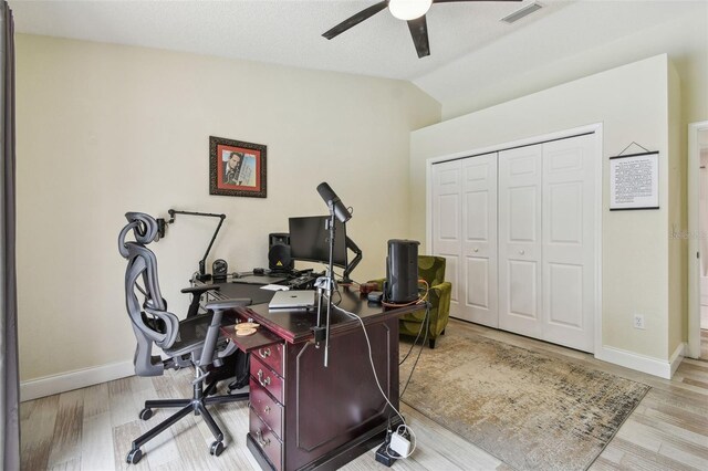 160 Sage Cir, Crystal Beach, FL 34681 - office space featuring ceiling fan, vaulted ceiling, wood finished floors, and baseboards