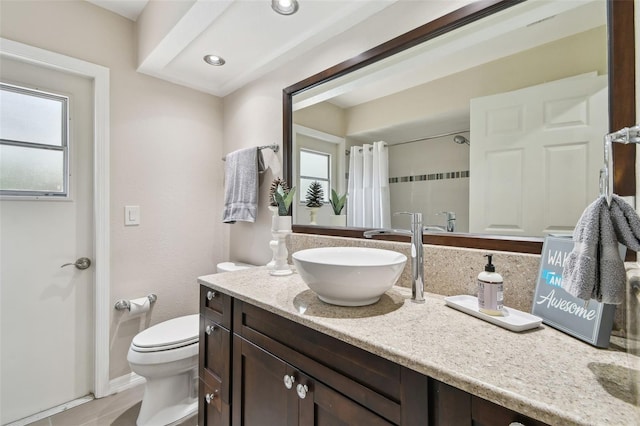 160 Sage Cir, Crystal Beach, FL 34681 - bathroom featuring healthy amount of natural light, toilet, vanity, and a shower with shower curtain