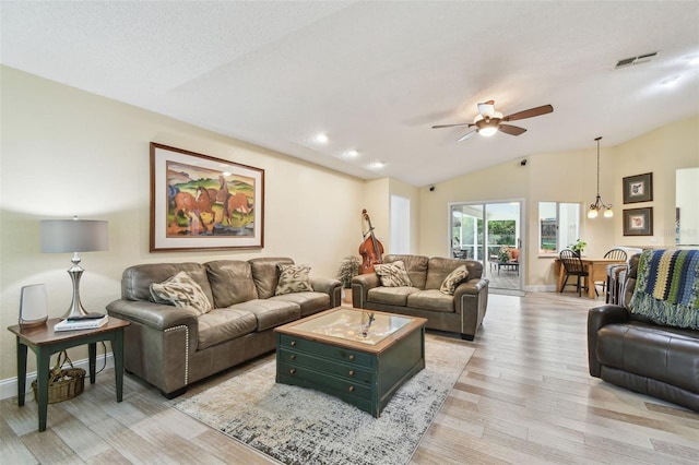 160 Sage Cir, Crystal Beach, FL 34681 - living room featuring vaulted ceiling, light wood-style flooring, ceiling fan, and baseboards