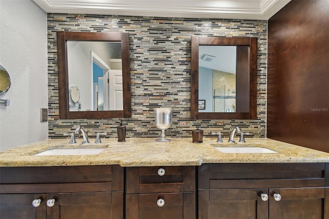 160 Sage Cir, Crystal Beach, FL 34681 - full bathroom with decorative backsplash, double vanity, crown molding, and a textured wall