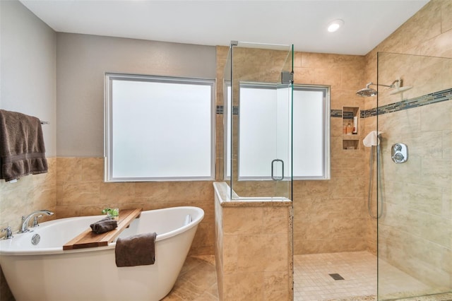 160 Sage Cir, Crystal Beach, FL 34681 - bathroom featuring a stall shower, a freestanding bath, and recessed lighting