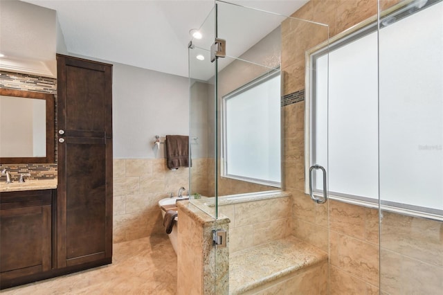 160 Sage Cir, Crystal Beach, FL 34681 - bathroom featuring tile walls, a shower stall, and vanity