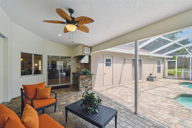 160 Sage Cir, Crystal Beach, FL 34681 - sunroom / solarium featuring ceiling fan, lofted ceiling, a hot tub, an outdoor hangout area, and exterior kitchen