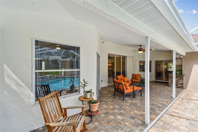 160 Sage Cir, Crystal Beach, FL 34681 - view of patio featuring ceiling fan, an outdoor hangout area, and glass enclosure