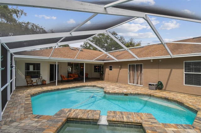 160 Sage Cir, Crystal Beach, FL 34681 - back of house featuring stucco siding, a patio area, roof with shingles, and a lanai