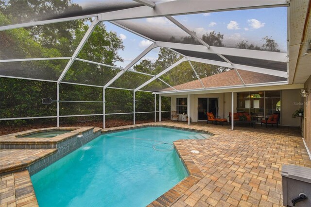 160 Sage Cir, Crystal Beach, FL 34681 - view of pool featuring a patio, glass enclosure, and a pool with connected hot tub