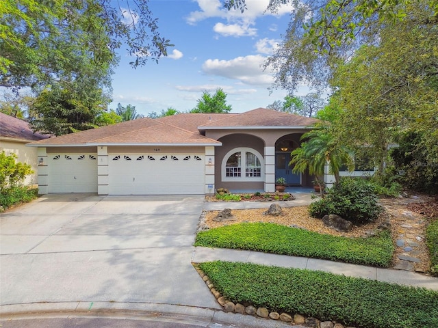 160 Sage Cir, Crystal Beach, FL 34681 - view of front of property featuring stucco siding, an attached garage, concrete driveway, and roof with shingles