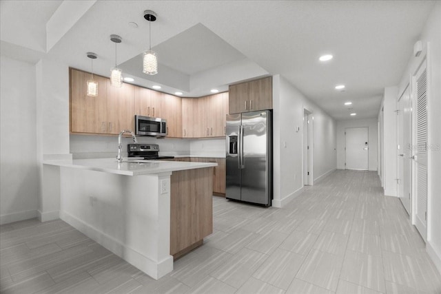 415 Island Way Unit 303, Clearwater Beach, FL 33767 - kitchen featuring appliances with stainless steel finishes, a sink, recessed lighting, light countertops, and a peninsula