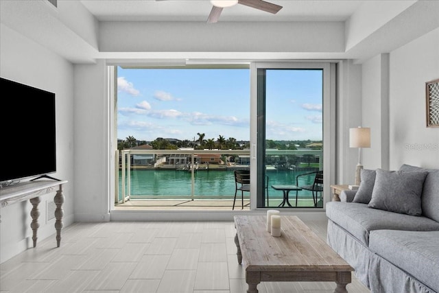 415 Island Way Unit 303, Clearwater Beach, FL 33767 - living room with ceiling fan and a water view