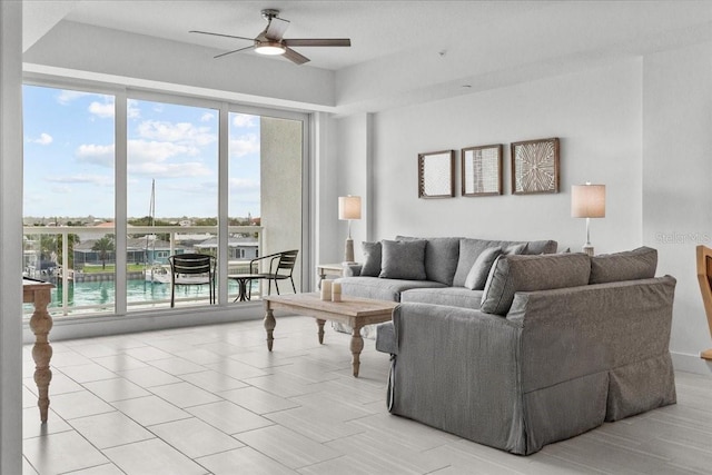 415 Island Way Unit 303, Clearwater Beach, FL 33767 - living area featuring ceiling fan and light tile patterned flooring
