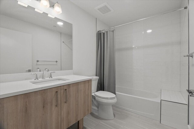 415 Island Way Unit 303, Clearwater Beach, FL 33767 - full bathroom featuring toilet, vanity, and shower / bath combo