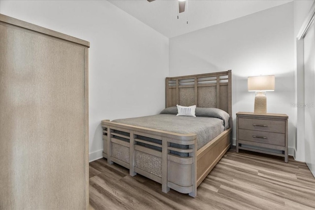 415 Island Way Unit 303, Clearwater Beach, FL 33767 - bedroom with wood finished floors and a ceiling fan