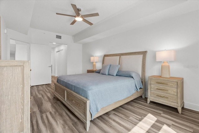 415 Island Way Unit 303, Clearwater Beach, FL 33767 - bedroom featuring wood finished floors and a ceiling fan