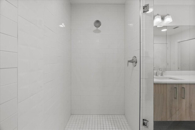 415 Island Way Unit 303, Clearwater Beach, FL 33767 - bathroom with tiled shower and vanity