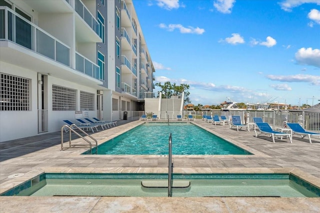 415 Island Way Unit 303, Clearwater Beach, FL 33767 - community pool featuring fence and a patio area