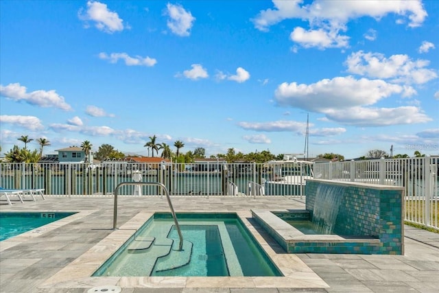 415 Island Way Unit 303, Clearwater Beach, FL 33767 - community pool featuring a patio and fence