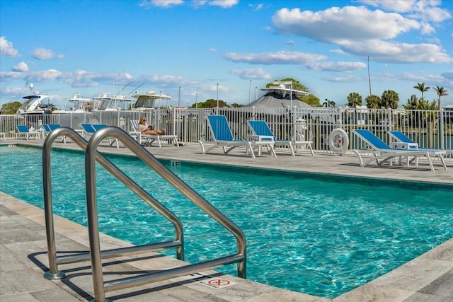 415 Island Way Unit 303, Clearwater Beach, FL 33767 - community pool with fence and a patio