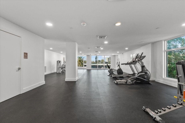 415 Island Way Unit 303, Clearwater Beach, FL 33767 - gym featuring recessed lighting, healthy amount of natural light, and baseboards