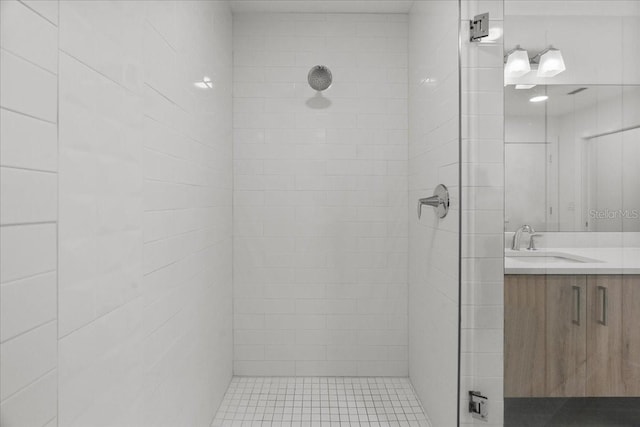 415 Island Way Unit 303, Clearwater Beach, FL 33767 - bathroom with a tile shower and vanity