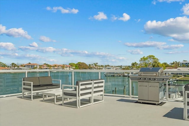 415 Island Way Unit 303, Clearwater Beach, FL 33767 - view of patio featuring area for grilling, a water view, and an outdoor living space