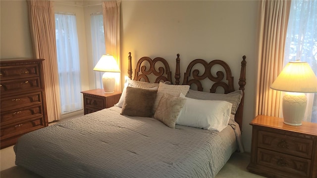 bedroom with multiple windows