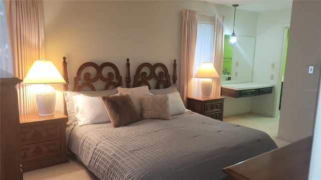 bedroom with light colored carpet