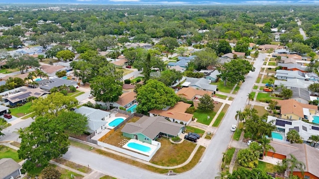 aerial perspective of suburban area featuring a pool area