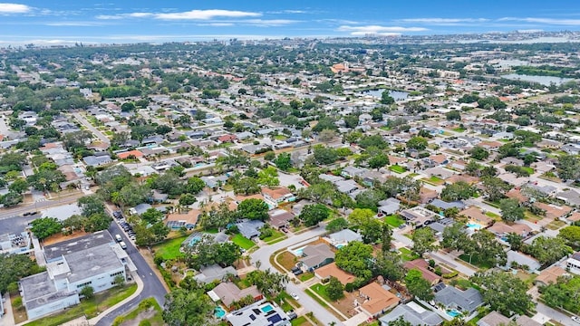 aerial overview of property's location with nearby suburban area and a large body of water