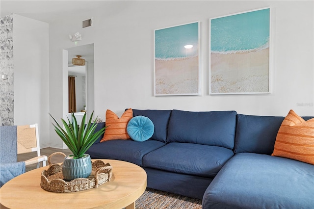 living area featuring baseboards