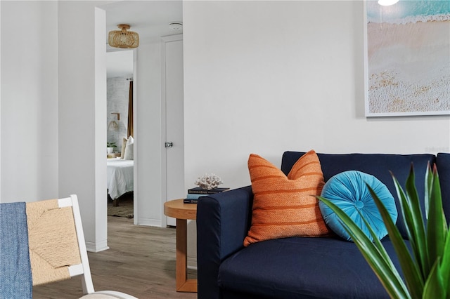 living area with wood finished floors and baseboards