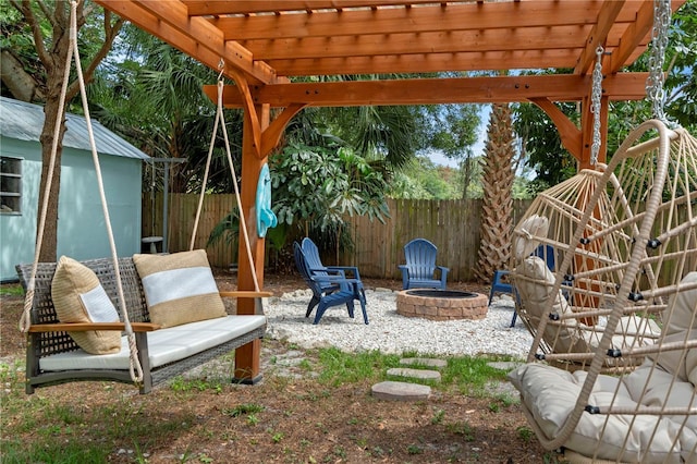 fenced backyard with an outdoor fire pit