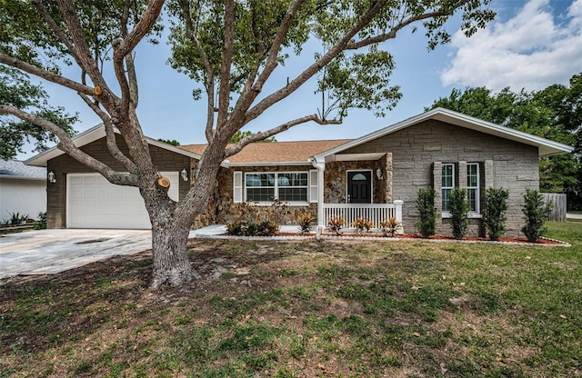 1402 Oleander Dr, Tarpon Springs, FL 34689 - view of front of home with stone siding, a garage, driveway, a front lawn, and a porch
