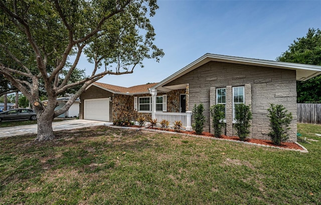 1402 Oleander Dr, Tarpon Springs, FL 34689 - single story home featuring stone siding, an attached garage, and driveway