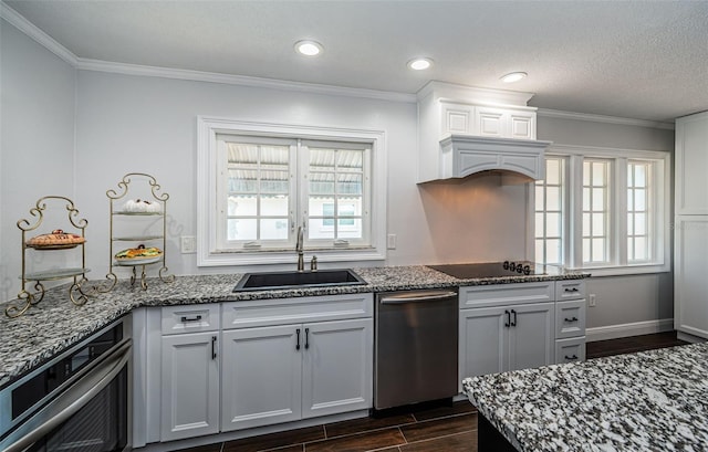 1402 Oleander Dr, Tarpon Springs, FL 34689 - kitchen featuring dishwasher, dark wood finished floors, a sink, healthy amount of natural light, and crown molding