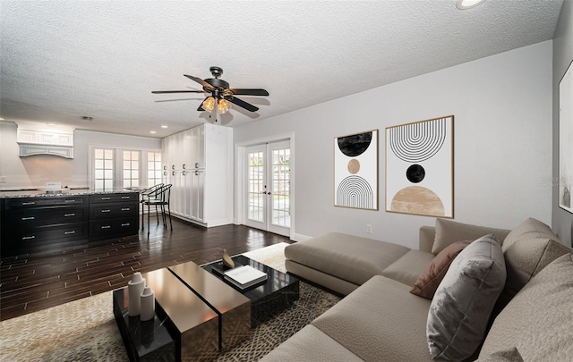 1402 Oleander Dr, Tarpon Springs, FL 34689 - living area featuring french doors, dark wood-style floors, ceiling fan, a textured ceiling, and recessed lighting