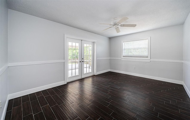 1402 Oleander Dr, Tarpon Springs, FL 34689 - spare room with wood tiled floors, french doors, baseboards, ceiling fan, and a textured ceiling