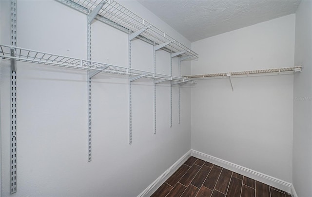 1402 Oleander Dr, Tarpon Springs, FL 34689 - walk in closet featuring wood tiled floors