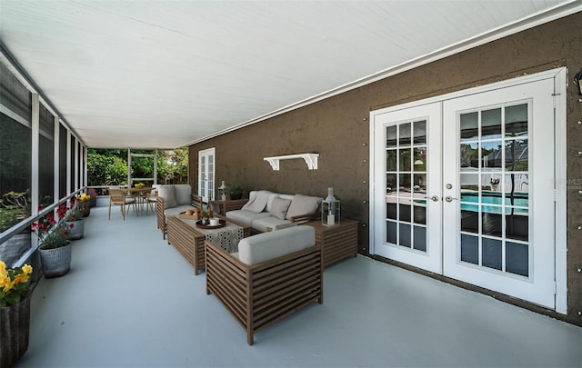 1402 Oleander Dr, Tarpon Springs, FL 34689 - sunroom / solarium featuring french doors and outdoor lounge area