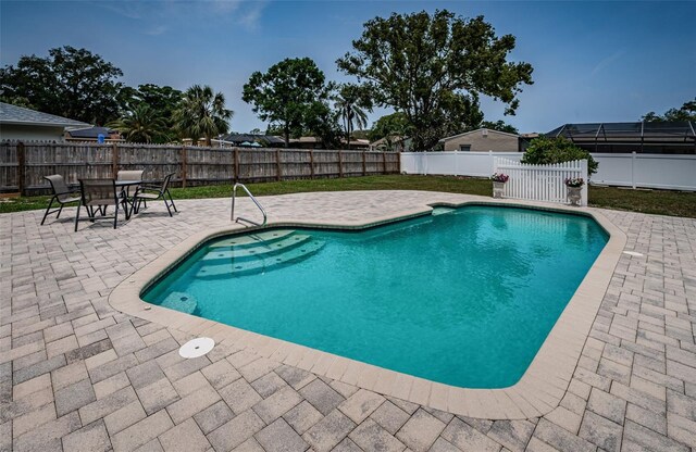 1402 Oleander Dr, Tarpon Springs, FL 34689 - view of pool with a patio and a fenced backyard