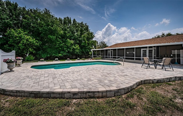1402 Oleander Dr, Tarpon Springs, FL 34689 - swimming pool featuring a sunroom, a patio, and fence
