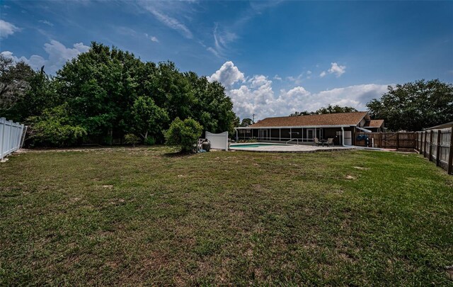 1402 Oleander Dr, Tarpon Springs, FL 34689 - view of yard with a patio area and a sunroom