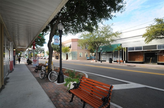 1402 Oleander Dr, Tarpon Springs, FL 34689 - view of asphalt road with sidewalks, street lights, and curbs