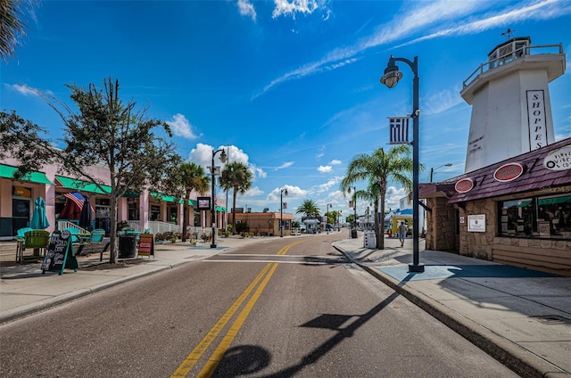 1402 Oleander Dr, Tarpon Springs, FL 34689 - view of asphalt road with sidewalks, curbs, and street lighting