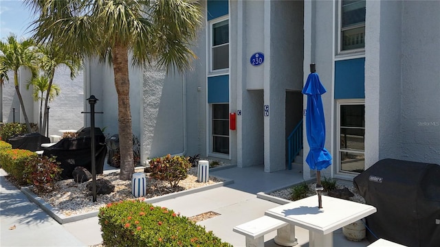 230 Medallion Blvd Unit G, Madeira Beach, FL 33708 - property entrance with stucco siding