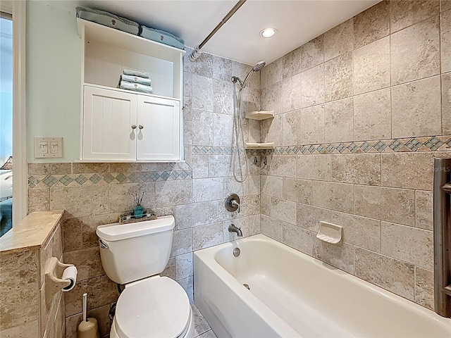 230 Medallion Blvd Unit G, Madeira Beach, FL 33708 - full bath with tile walls, toilet, and tub / shower combination