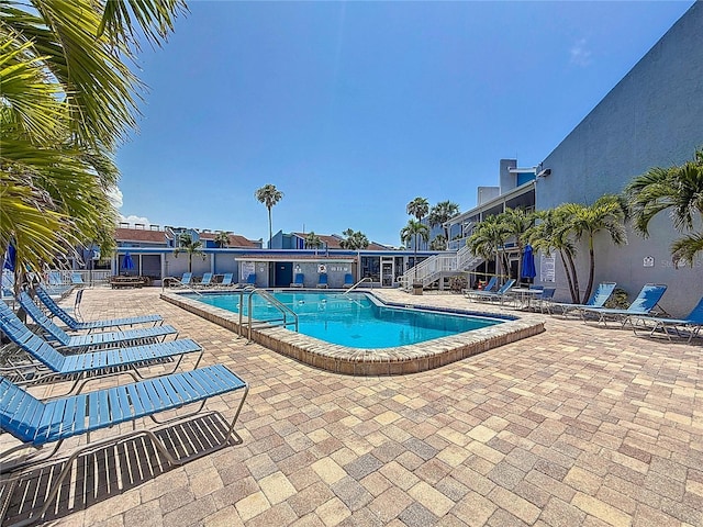 230 Medallion Blvd Unit G, Madeira Beach, FL 33708 - community pool featuring a patio area