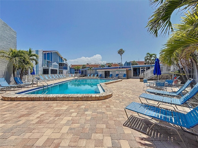 230 Medallion Blvd Unit G, Madeira Beach, FL 33708 - community pool featuring a patio